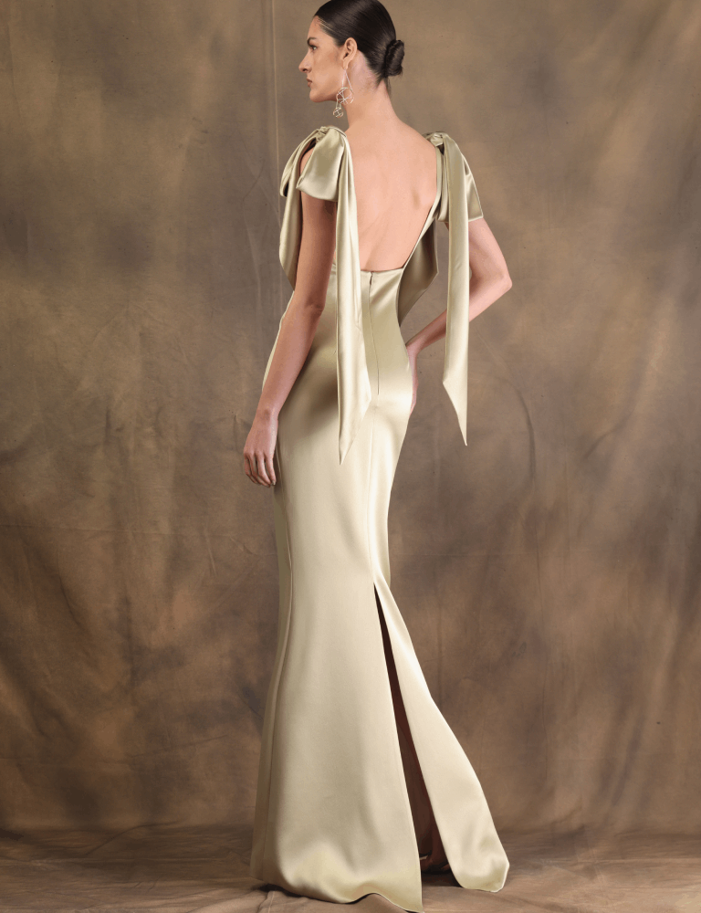back of Gold Fely Campo evening gown with structured bows on the shoulders and a fitted silhouette