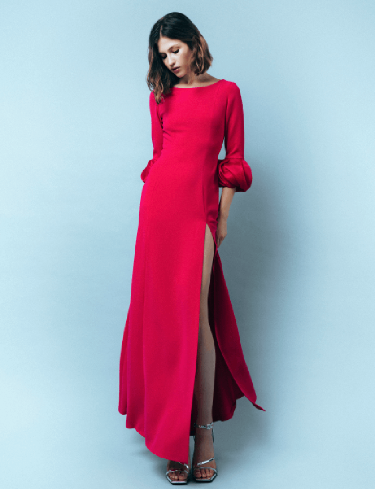 Red Fely Campo gown with puffed sleeves and high leg slit